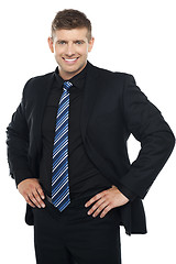 Image showing Confident young businessman posing casually