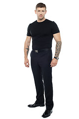 Image showing Strong male bouncer. Tattoo on both his hands