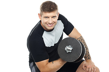 Image showing Muscular man working out with barbell