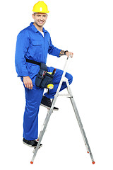 Image showing Construction worker climbing up the stepladder