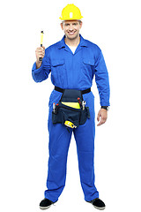 Image showing Industrial contractor holding hammer. Full length shot