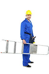 Image showing Young repairman ready with stepladder