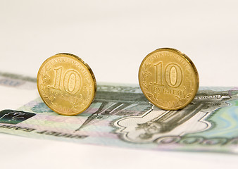 Image showing Two coins on banknote