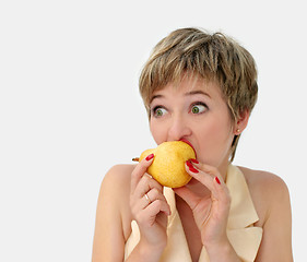 Image showing Funny girl with a pear