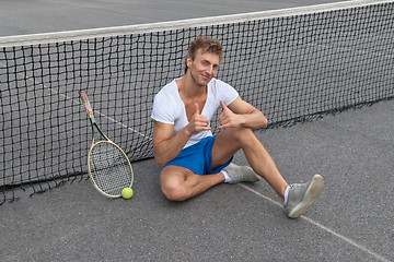 Image showing Tennis player showing thumbs up