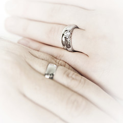 Image showing Hands wearing wedding rings