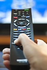 Image showing Hand with television remote control