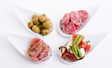 Image showing deliscious antipasti plate with parma parmesan and olives