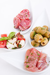 Image showing deliscious antipasti plate with parma parmesan and olives