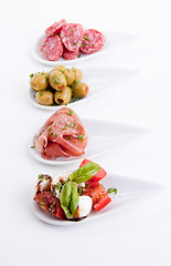 Image showing deliscious antipasti plate with parma parmesan and olives