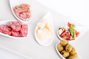 Image showing deliscious antipasti plate with parma parmesan and olives