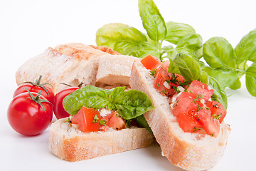 Image showing deliscious fresh bruschetta appetizer with tomatoes isolated