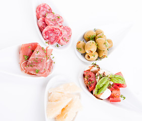 Image showing deliscious antipasti plate with parma parmesan and olives