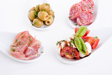 Image showing deliscious antipasti plate with parma parmesan and olives