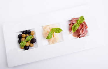 Image showing deliscious antipasti plate with parma parmesan and olives