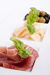 Image showing deliscious antipasti plate with parma parmesan and olives