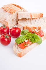 Image showing deliscious fresh bruschetta appetizer with tomatoes isolated