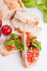 Image showing deliscious fresh bruschetta appetizer with tomatoes isolated