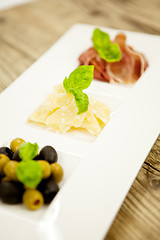 Image showing deliscious antipasti plate with parma parmesan olives 