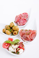 Image showing deliscious antipasti plate with parma parmesan and olives