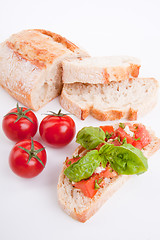 Image showing deliscious fresh bruschetta appetizer with tomatoes isolated