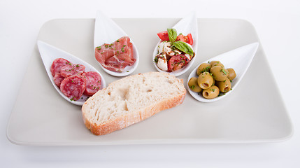 Image showing deliscious antipasti plate with parma parmesan and olives