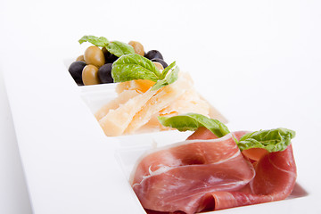 Image showing deliscious antipasti plate with parma parmesan and olives