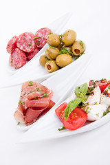 Image showing deliscious antipasti plate with parma parmesan and olives