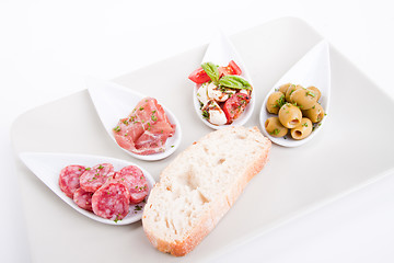 Image showing deliscious antipasti plate with parma parmesan and olives