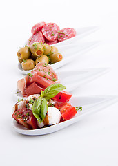 Image showing deliscious antipasti plate with parma parmesan and olives