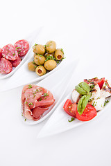 Image showing deliscious antipasti plate with parma parmesan and olives