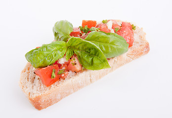 Image showing deliscious fresh bruschetta appetizer with tomatoes isolated