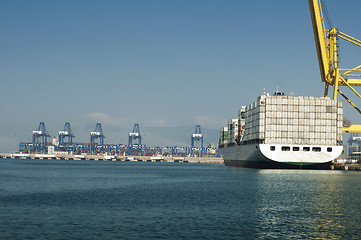 Image showing Freighter in port being loaded with containers