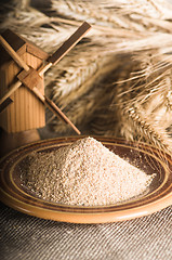 Image showing Wholemeal flour and wheat on cloth sack, close-up
