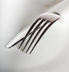 Image showing Plug and knife on a white plate