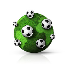 Image showing green grass world globe with soccer balls