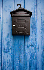 Image showing Mailbox in a blue door