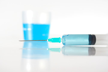 Image showing Syringe with blue liquid