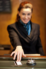 Image showing Lady returning the cash card to the customer