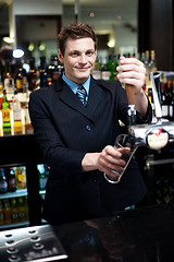 Image showing Bartender preparing to make cocktail