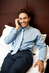 Image showing Businessman attending personal calls after work