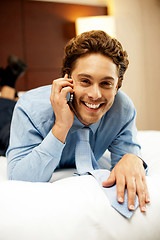 Image showing Relaxed young businessman communicating with his partner