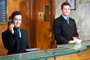 Image showing Profile shot of attractive executives at the reception