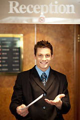 Image showing Young man holding an invoice