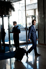 Image showing Caucasian guest walking towards the reception