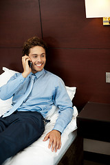 Image showing Relaxed cool guy talking on the phone