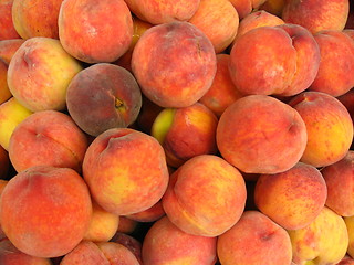 Image showing Many bright tasty peaches