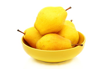 Image showing Four ripe pears in the yellow bowl.
