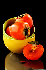 Image showing Persimmon fruits in a bowl.