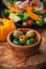 Image showing Delicious green olives with salad